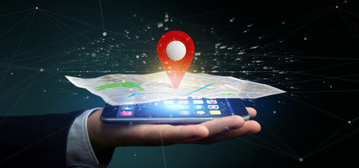 Poster - Businessman holding a 3d rendering pin holder on a map