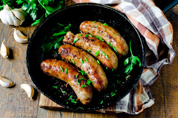 Homemade sausages from turkey (chicken) fried in a frying pan