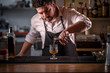 © Grafvision - Bartender is pouring alcohol