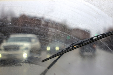 Wall Mural - Windshield wipers from inside of car, season rain.