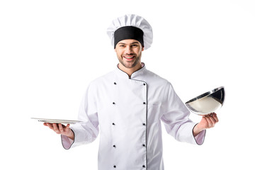 Wall Mural - portrait of smiling chef with empty serving tray isolated on white