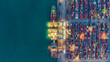 © MAGNIFIER - Container ship in export and import business and logistics. Shipping cargo to harbor by crane. Water transport International. Aerial view and top view.