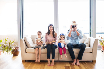 Wall Mural - Young family with two children getting ready for holiday.