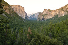 View Over A Green Valley And The Famous El Capitan Mountain At Sunset. El Capitan Is A Vertical Rock Formation In Yosemite National Park, California, USA