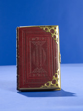 Gold Bound Red Book On Blue Background