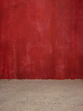 Red Wall And Dirt Floor