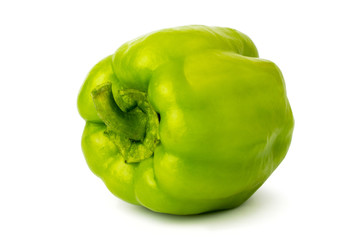 Wall Mural - Green bell peppers on a white, close up.