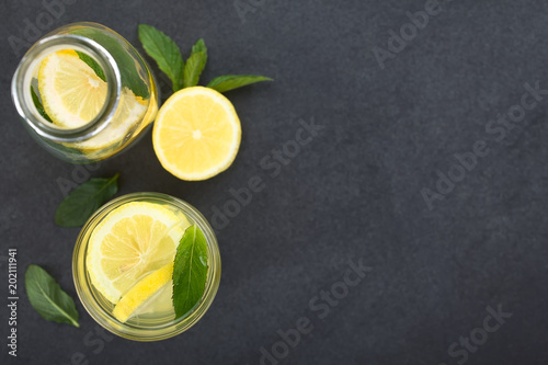 Fotografía Fresh homemade lemonade with mint leaves, photographed overhead on slate (Select