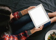 Woman hands holding tablet empty blank screen sitting bed top