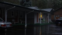 Zoom-in on motel cabins on a rainy evening near Grants Pass, Oregon