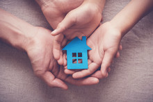 Adult And Child Hands Holding Paper House, Family Home, Homeless Shelter, Foster Home Care, Family Day Care, Social Distancing, Stay At Home Concept