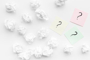 Poster - FAQ concept. Question mark on sticky notes near crumpled paper on white background top view