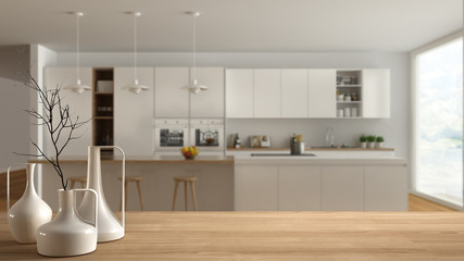 Wooden table top or shelf with minimalistic modern vases over blurred scandinavian modern kitchen, white interior design