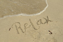 RELAX Hand-lettered In Sand On Beach