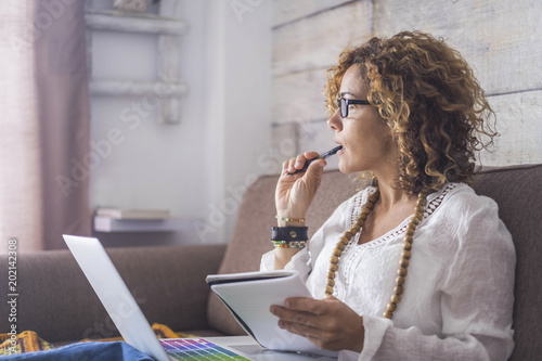 Fotomural nice woman type on a laptop working at home freedom and happy