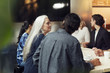 © Johnér - People sitting by table