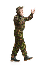 Wall Mural - Young army soldier wearing camouflage uniform isolated on white