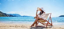 Woman Enjoying Sunbathing At Beach