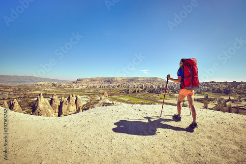 Fotografie, Tablou Traveling is a tourist route with a backpack.