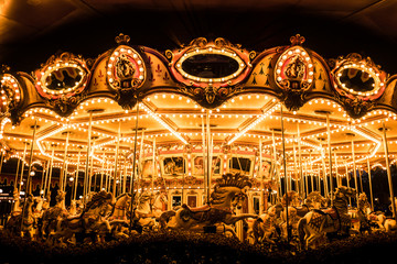 Merry-Go-Round (carousel) illuminated at night. 