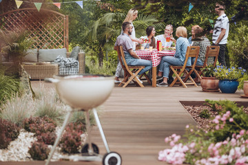 Grill on wooden garden patio