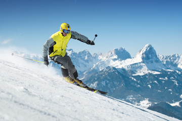 Wall Mural - Skier in high mountains