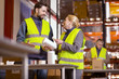 © zinkevych - Professional cooperation. Positive nice colleagues having a conversation while putting labels on different products