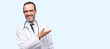 Leinwandbild Motiv Doctor senior man, medical professional holding something in empty hand isolated over blue background
