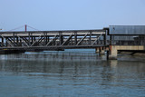 Fototapeta Pomosty - Passenger boarding bridge for access to the boat in a harbor in Lisbon, Portugal