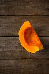 Poster - slice of pumpkin on wooden surface