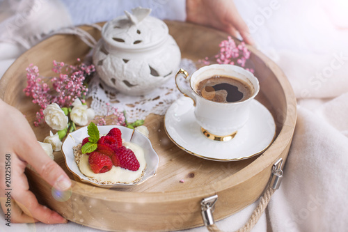 A Woman Is Drinking Coffee In Bed A Wooden Tray With Breakfast