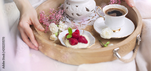 A Woman Is Drinking Coffee In Bed A Wooden Tray With Breakfast