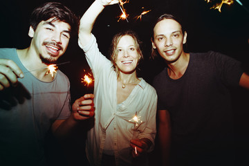 Wall Mural - Friends playing with sparklers