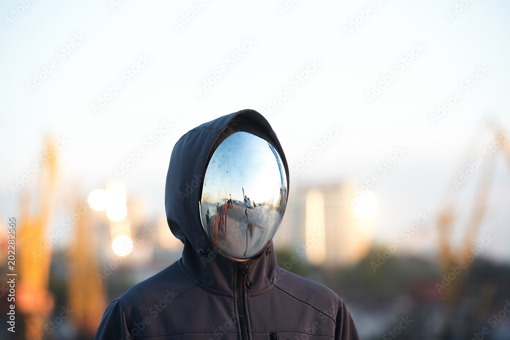 Faceless character with the mirror mask with port in background. - obrazy, fototapety, plakaty 