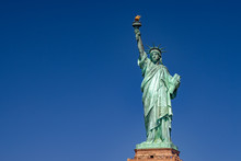 Statue Of Liberty In New York On Blue Sky