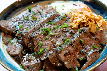 Wall Mural - Beef Steak Donburi with egg and fried garlic