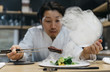 © Jose Luis Carrascosa Martinez/ADDICTIVE STOCK - Chef cooking in restaurant with smoke dish