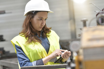 Wall Mural - Metal industry engineer controlling work in factory