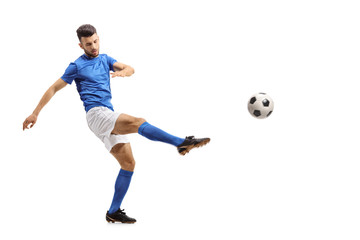 Sticker - Soccer player kicking a football