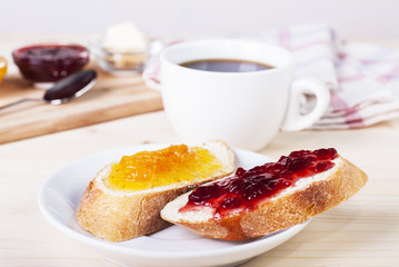 Sticker - two sandwiches with different jam, against a background of a cup of coffee