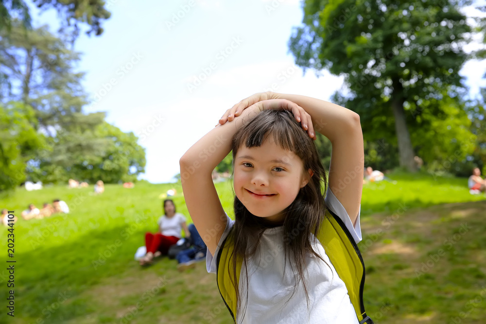 Portrait of little girl smiling in the park Stock Photo | Adobe Stock