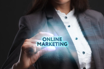 The concept of business, technology, the Internet and the network. A young entrepreneur working on a virtual screen of the future and sees the inscription: Online marketing