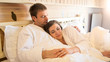 © Kyrylo Ryzhov - Portrait of young man lying with beautiful woman on bed at hotel