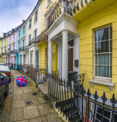 Wall Mural - London, England - Colorful Victorian houses of Primrose hill with british style umbrella and blue sky