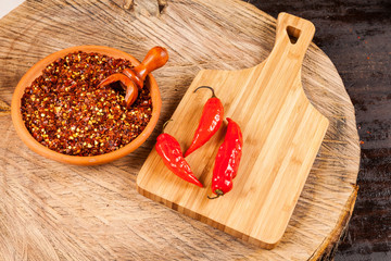 Wall Mural - red pepper or cayenne pepper crushed with flakes scattered 