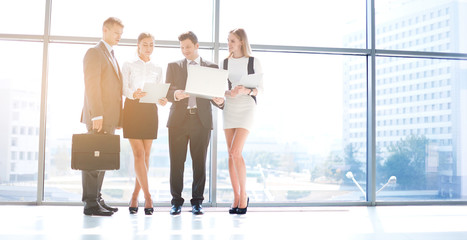 Wall Mural - Group of business people doing presentation with laptop during meeting. Group of business people