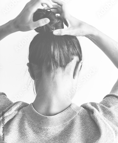 Woman Making Hair Bun Buy This Stock Photo And Explore Similar