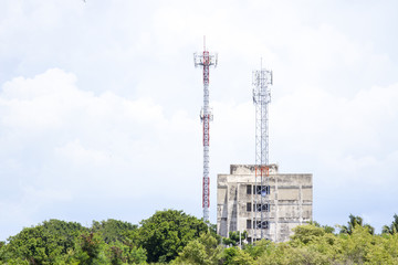 Wall Mural - Mobile phone communication tower transmission  signal with blue sky background