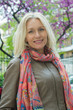 © PhotoAlto - Mature woman smiling outdoors, portrait