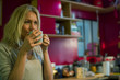 © PhotoAlto - Mature woman drinking coffee at home